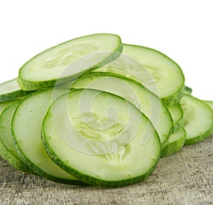 Freshly sliced cucumber on background.