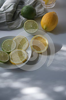 Freshly sliced lemons and limes with refreshing drink