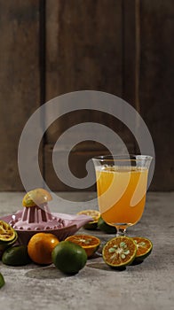 Freshly Squashed Orange Juice (Jeruk Peras in Indonesia) Serve on A Glass photo