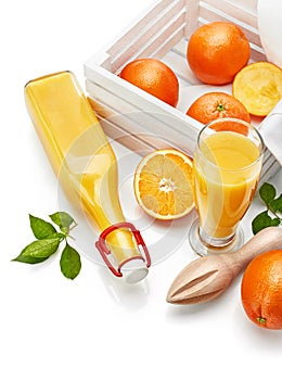 Freshly squeezed orange juice in glass bottle