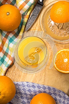 Freshly squeezed orange juice with ice cubes in a glass