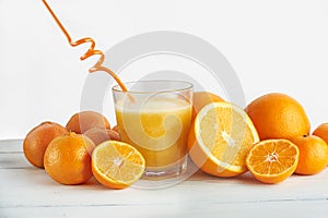 Freshly squeezed orange juice and oranges