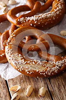 Freshly traditional pretzels with salt close up on the paper. ve