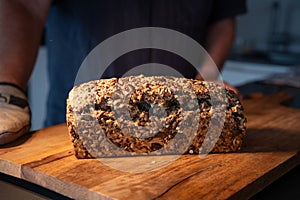 Freshly whole grain bread on wood surface