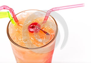 Freshness cocktail with ice in glass with drinking straw