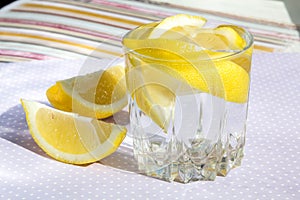 Freshness concept, homemade lemonade Summer detox drink with lemon in glass jars. Fresh water, refreshment drink