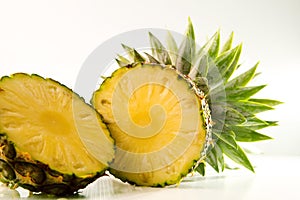 Freshness of sliced pineapple on white background