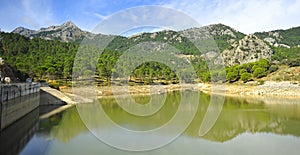Dam of Fresnillo reservoir, Sierra de Grazalema Natural Park, province of CÃÂ¡diz, Spain photo