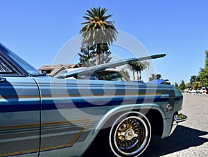 Blue custom colored 1965 Chevy Impala Convertible at car show in Ca. 2021