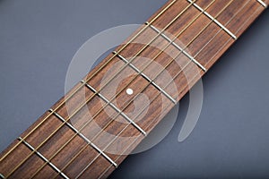 Fretboard on Acoustic Guitar Close-Up on Fifth Fret