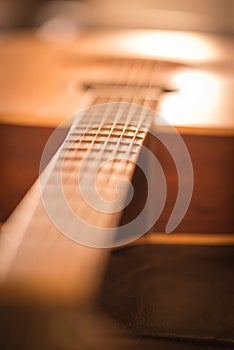 Fretboard close up on acoustic guitar