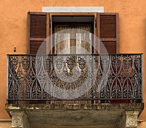 A fretwork balcony on the antic house of Italy