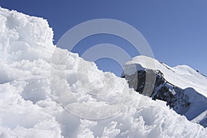 Friable snowdrift melting in the sun, close-up