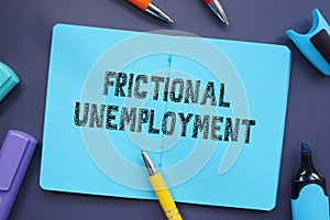 Frictional Unemployment inscription on the piece of paper photo