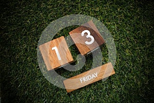 Friday 13th on wooden calendar. bad luck, Misfortune Day.