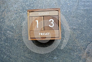 Friday 13th on wooden calendar. bad luck, Misfortune Day, Halloween Concept.