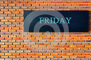 Friday letters on a black background with brick wall