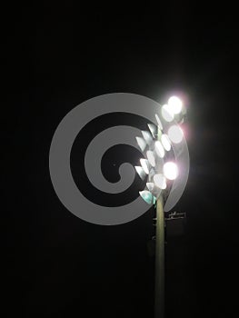 Friday night lights: Playing field floodlights against night sky #2