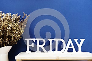 Friday word decorative letters on wooden background
