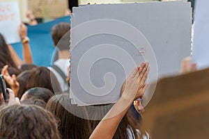 Fridays for future: student hand showing blank board