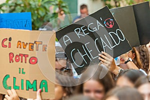 Fridays for future: students hands showing  banners and boards