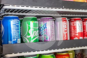 A fridge full of soda cans