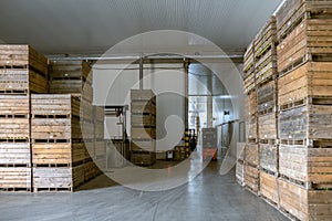 A fridges airless storage vegetables or fruits. The electric forklift move it container. Production facilities of large warehouse
