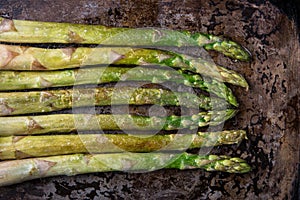 Fried asparagus on a baking sheet.