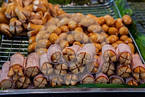 Fried bacon hot dogs, fast food, commercially available photo