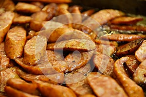 Fried baked sausage top view. Delicious street food