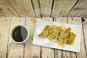 Fried Banana (Pisang Goreng), traditional snack in Malaysia with black coffee cup.