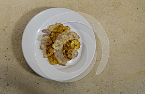 fried banana on white plate, ingredient of & x22;chile en nogada& x22;, typical dish of gastronomy in puebla, Mexico photo