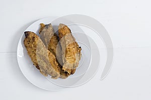 Fried bananas, banana fritters or pisang goreng on white background photo