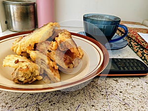 Fried bananas are a traditional Indonesian food that is very popular as an accompaniment to coffee before activities photo