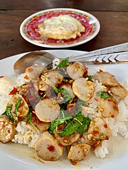 Fried basil, meatballs and omelettes