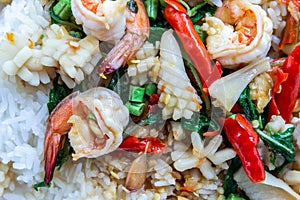 Fried basil shrimp with squid topped with rice