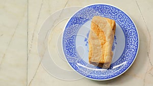 Fried bean curd in blue chinese dish