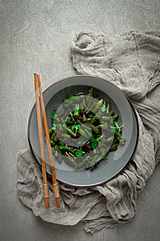 fried bean pods, in soy sauce, with sesame seeds, homemade, no people,