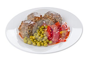 Fried beef meatballs with lecho and green peas in plate isolated on white