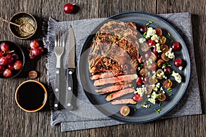 fried beef steak with salad of grape, cheese