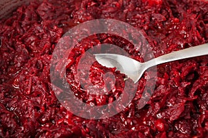 Fried beetroot, cooking process, spoon close-up, selective focus. Ingredient for borscht or healthy vegetarian salad