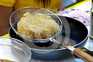 Fried bihon filipino noodle on the pan