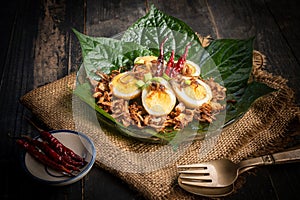 Fried boiled egg with tamarind sauce