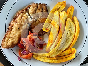 Fried Breakfast Dish with Fish and fried banana