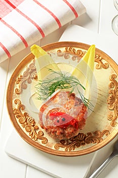 Fried burger and endive leaves