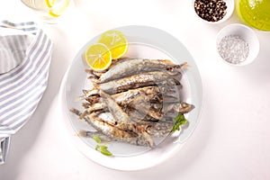 Fried capelin or smelt small fish with lemon