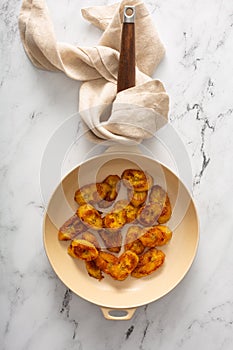 Fried caramelized plantains in a pan