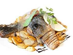 Fried carp fillet with fried potatoes