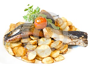 Fried carp fillet with fried potatoes