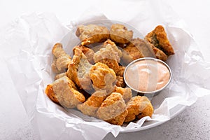 Fried catfish nuggets served with remoulade sauce photo